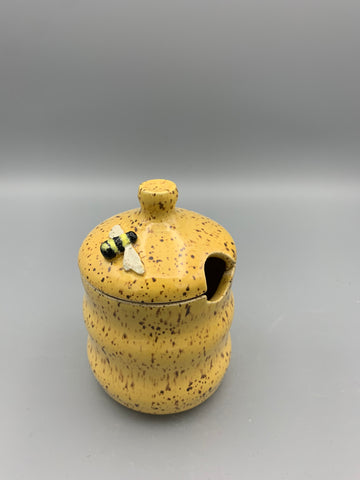 Bee atop a Honey Pot